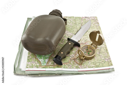 Photo: Army canteen, a knife and a compass are on the map Army canteen, a knife and a compass are on the map