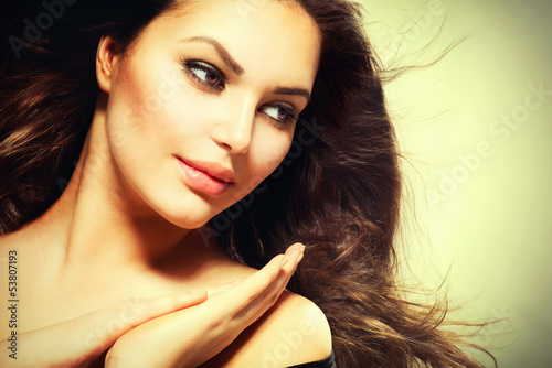 Photo: Beautiful Brunette Woman with Blowing Healthy Hair Beautiful Brunette Woman with Blowing Healthy Hair