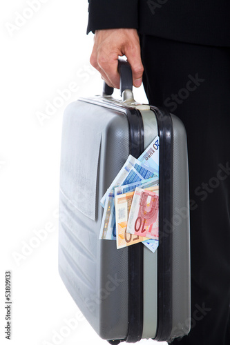 Photo: Mann trägt Aktenkoffer voller Geld Mann trägt Aktenkoffer voller Geld