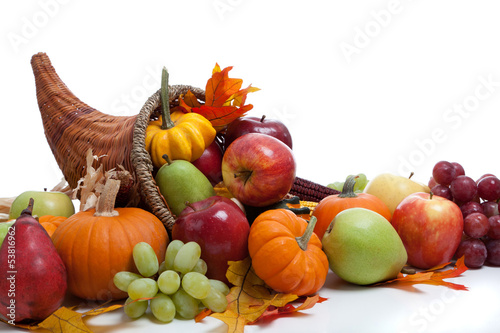 Photo: An overflowing cornucopia on a white background An overflowing cornucopia on a white background