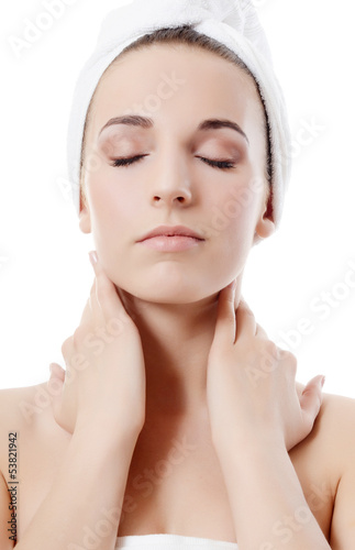 Photo: Spa beautiful woman isolated on white background.Touches the fac Spa beautiful woman isolated on white background.Touches the fac