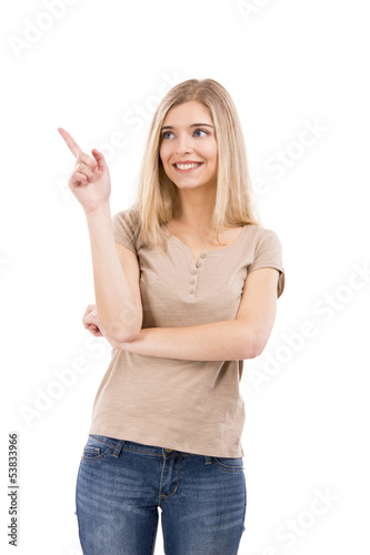 Photo: Beautiful woman smiling and pointing Beautiful woman smiling and pointing