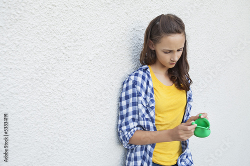 Photo: Girl looking at an empty purse Girl looking at an empty purse