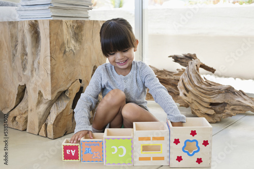 Photo: Girl playing with number blocks Girl playing with number blocks