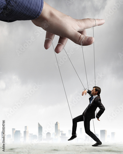 Photo: Business man marionette Business man marionette