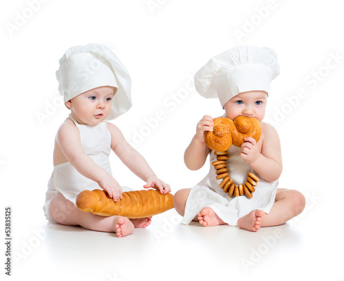 Photo: Little bakers babies boy and girl isolated Little bakers babies boy and girl isolated