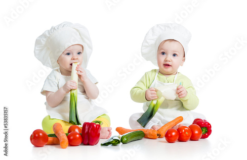 Photo: children boy and girl wearing chef hat with healthy food vegeta children boy and girl wearing chef hat with healthy food vegeta