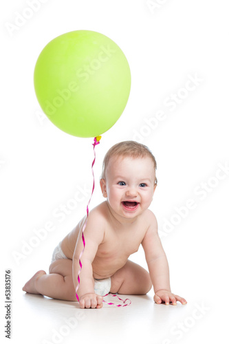 Photo: Smiling baby boy with green ballon in his hand isolated on whit Smiling baby boy with green ballon in his hand isolated on whit