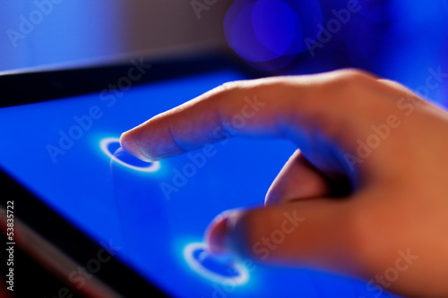 Photo: Finger touching screen Finger touching screen