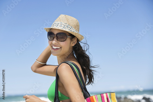 Photo: Beautiful woman smiling on the beach Beautiful woman smiling on the beach
