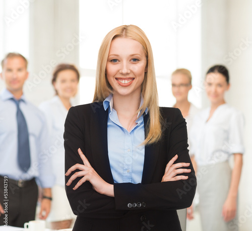Photo: smiling businesswoman in office smiling businesswoman in office