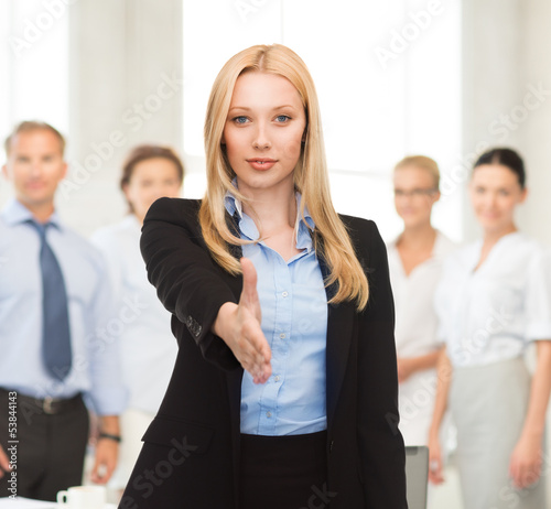 Photo: woman with an open hand ready for handshake woman with an open hand ready for handshake