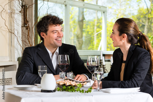 Photo: Businesspeople having lunch in restaurant Businesspeople having lunch in restaurant