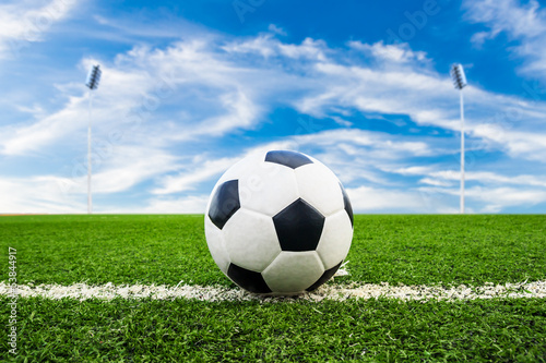 Photo: soccer ball on green grass field soccer ball on green grass field