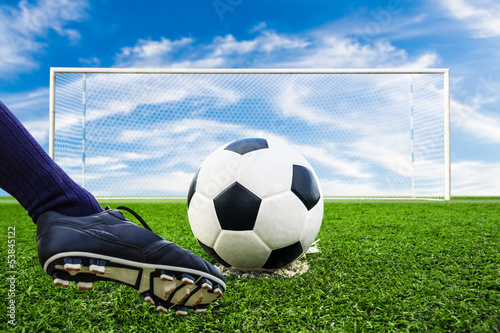 Photo: foot kicking soccer ball foot kicking soccer ball