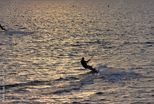 Photo: kitesurfer at sunset kitesurfer at sunset