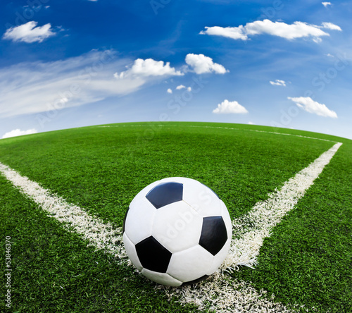 Photo: soccer ball on green grass field soccer ball on green grass field