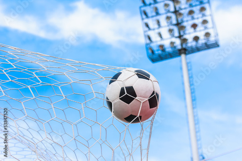 Photo: soccer ball in goal net soccer ball in goal net