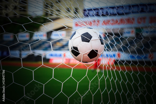 Photo: soccer ball in goal net soccer ball in goal net