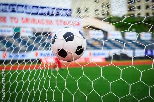 Photo: soccer ball in goal net soccer ball in goal net