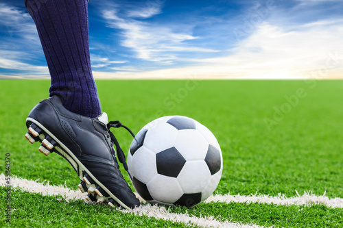 Photo: foot kicking soccer ball foot kicking soccer ball