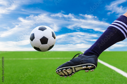 Photo: foot kicking soccer ball foot kicking soccer ball