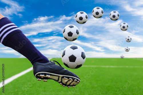 Photo: foot kicking soccer ball foot kicking soccer ball