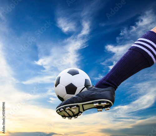 Photo: foot kicking soccer ball foot kicking soccer ball