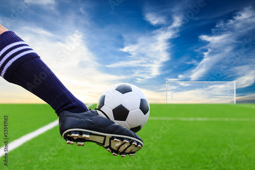 Photo: foot kicking soccer ball foot kicking soccer ball