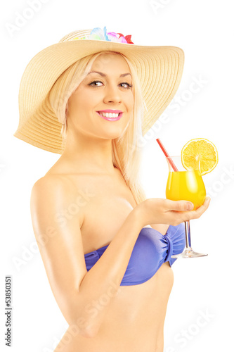 Photo: Beautiful blond female in bikini holding a cocktail Beautiful blond female in bikini holding a cocktail