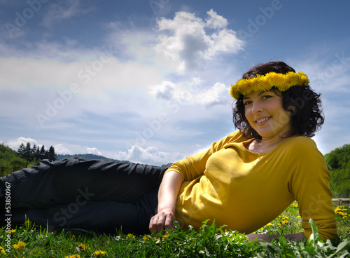Photo: A young woman smiling wearing a yellow top A young woman smiling wearing a yellow top