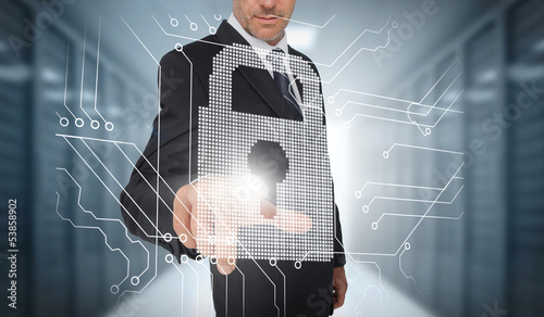 Photo: Businessman selecting a futuristic padlock Businessman selecting a futuristic padlock