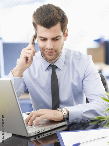 Photo: Businessman on phone Businessman on phone