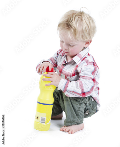 Photo: Infant playing with toxic bottle Infant playing with toxic bottle