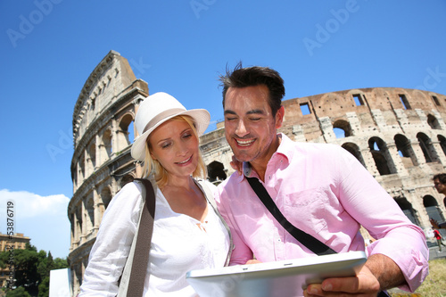 Photo: Couple in Rome using tablet to get tourist information Couple in Rome using tablet to get tourist information