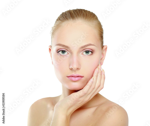 Photo: A beautiful woman touching her face, portrait A beautiful woman touching her face, portrait