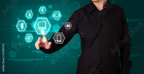 Photo: Businessman pressing virtual media type of buttons Businessman pressing virtual media type of buttons