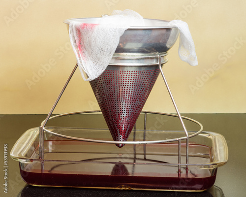 Photo: Filtering fresh strawberries to make jelly Filtering fresh strawberries to make jelly