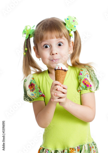 Photo: funny kid girl eating ice cream in studio isolated funny kid girl eating ice cream in studio isolated