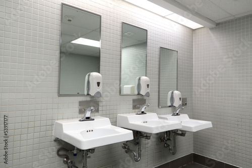 Photo: Clean new public toilet room empty Clean new public toilet room empty