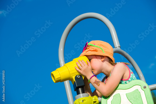 Photo: Girl and jungle gym Girl and jungle gym