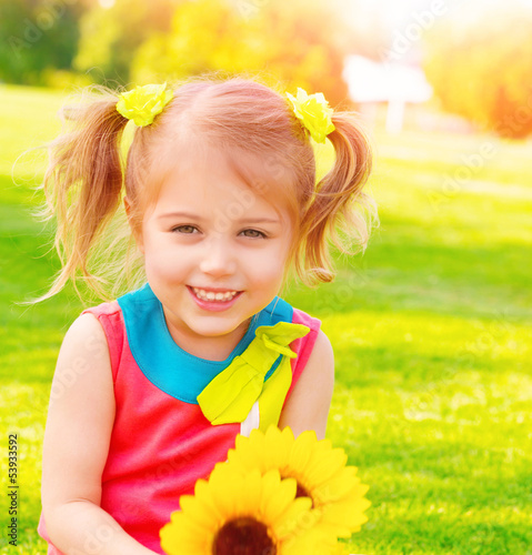 Photo: Little girl with sunflowers bouquet Little girl with sunflowers bouquet