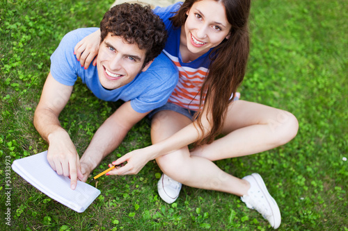 Photo: Students sitting on grass Students sitting on grass