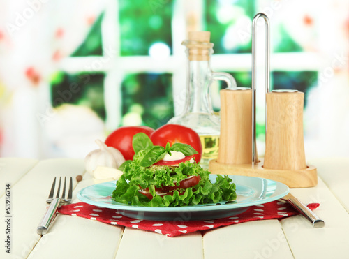 Photo: Tasty roasted marrow and tomato slices with salad leaves, Tasty roasted marrow and tomato slices with salad leaves,