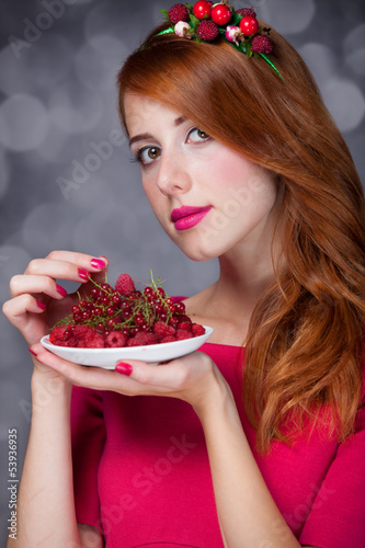 Photo: Redhead women with berries Redhead women with berries