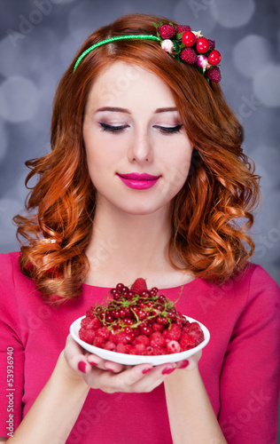 Photo: Redhead women with berries Redhead women with berries