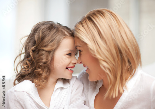 Photo: mother and daughter cuddling mother and daughter cuddling