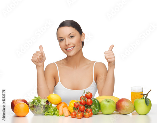 Photo: happy woman with fruits and vegetables happy woman with fruits and vegetables