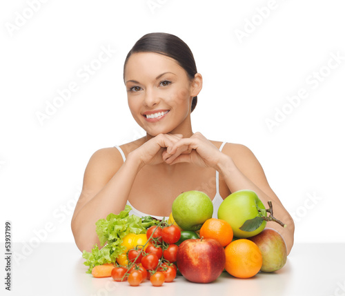 Photo: happy woman with lot of fruits and vegetables happy woman with lot of fruits and vegetables