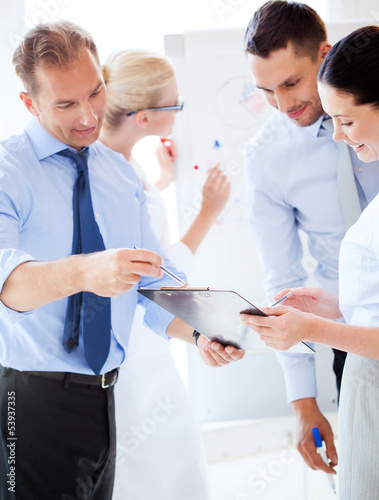 Photo: business team having discussion in office business team having discussion in office